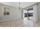 Sunlit dining area featuring neutral walls and sliding glass door at 2785 Donatello Manor Pl, Henderson, NV 89044
