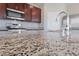 Close up shot of the granite countertops and stainless steel appliances in the kitchen at 2785 Donatello Manor Pl, Henderson, NV 89044
