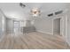 Spacious living room featuring hardwood floors, neutral walls, and entry to other rooms at 2785 Donatello Manor Pl, Henderson, NV 89044