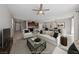 Open concept living room featuring stylish decor and a ceiling fan at 2785 Donatello Manor Pl, Henderson, NV 89044