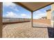 Large patio area with pavers and a covered area provides outdoor living space at 2785 Donatello Manor Pl, Henderson, NV 89044