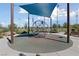 Shaded playground area with unique climbing structure, perfect for ' active play in a community park at 2785 Donatello Manor Pl, Henderson, NV 89044