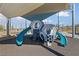 Modern playground with climbing structures, slides, and covered shade for enjoyment at 2785 Donatello Manor Pl, Henderson, NV 89044