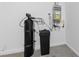 Efficient utility room featuring a water heater and filtration system at 2785 Donatello Manor Pl, Henderson, NV 89044