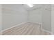 Walk-in closet with laminate floors and white shelving for optimal storage space at 2785 Donatello Manor Pl, Henderson, NV 89044