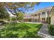 Expansive backyard boasts a lush lawn, patio, and beautiful landscaping with mature trees at 3102 La Mirada Ave, Las Vegas, NV 89120