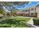 Expansive backyard boasts a lush lawn, patio, and beautiful landscaping with mature trees at 3102 La Mirada Ave, Las Vegas, NV 89120