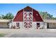 Red and white barn structure with 'Sierra Vista Ranchos' signage and functional doors at 3102 La Mirada Ave, Las Vegas, NV 89120