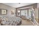 A stylish bedroom featuring a bay window with shutters and an ensuite bathroom at 3102 La Mirada Ave, Las Vegas, NV 89120