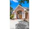 Grand entrance with a brick facade, white columns, and an arched doorway at 3102 La Mirada Ave, Las Vegas, NV 89120