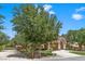 Charming two-story home with a circular driveway and mature landscaping at 3102 La Mirada Ave, Las Vegas, NV 89120