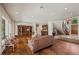 Spacious living room with hardwood floors, custom built-ins, and a winding staircase at 3102 La Mirada Ave, Las Vegas, NV 89120