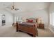 Spacious main bedroom featuring a ceiling fan, plush carpeting, and lots of natural light at 3102 La Mirada Ave, Las Vegas, NV 89120
