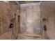 An elegant shower featuring stone tile and dual shower heads at 3102 La Mirada Ave, Las Vegas, NV 89120