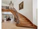 Elegant staircase with wood steps and wrought iron railings, leading to the second floor at 3102 La Mirada Ave, Las Vegas, NV 89120