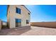 This backyard is enclosed by a block wall and has a sliding glass door to access the home at 340 Taylor St, Henderson, NV 89015