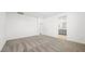 This bedroom boasts neutral walls and carpet flooring, with a view to an attached bathroom at 340 Taylor St, Henderson, NV 89015