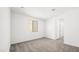 This bedroom features neutral walls, carpet flooring, and a window bringing in natural light at 340 Taylor St, Henderson, NV 89015