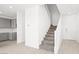 Bright entry with view of stairs, LVP flooring and modern kitchen at 340 Taylor St, Henderson, NV 89015