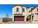 Stylish two-story home featuring desert landscaping, a brick driveway and a two car garage at 340 Taylor St, Henderson, NV 89015