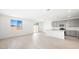 Bright open concept kitchen features white countertops, island, stainless appliances and backsplash at 340 Taylor St, Henderson, NV 89015