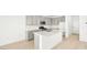 Bright kitchen boasts an island, modern appliances and subway tile backsplash at 340 Taylor St, Henderson, NV 89015