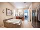 Bathroom with a soaking tub, glass shower and neutral colors at 3468 Isle Dr, Las Vegas, NV 89141
