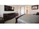 Bedroom with a TV on a wood cabinet with fireplace beneath at 3468 Isle Dr, Las Vegas, NV 89141