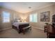 This inviting bedroom features neutral tones, plantation shutters, and stylish decor at 3468 Isle Dr, Las Vegas, NV 89141