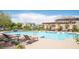 Beautiful community pool area with lounge chairs and a pergola, offering a relaxing outdoor space at 3468 Isle Dr, Las Vegas, NV 89141