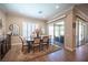 Elegant dining room with natural light and access to the backyard patio at 3468 Isle Dr, Las Vegas, NV 89141