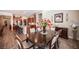 Warm and inviting dining area with elegant furniture and a view into the modern kitchen at 3468 Isle Dr, Las Vegas, NV 89141