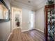 Inviting entryway featuring wood flooring, neutral paint, and an ornate front door with decorative glass insert at 3468 Isle Dr, Las Vegas, NV 89141