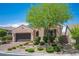 Beautiful single-story home with well-maintained landscaping, a brick driveway, and an attached two-car garage at 3468 Isle Dr, Las Vegas, NV 89141