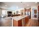 Open-concept kitchen with a large island, stainless steel appliances, and seamless flow to the living area at 3468 Isle Dr, Las Vegas, NV 89141