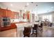 Well-equipped kitchen with granite countertops, stainless steel appliances, and an island with bar seating at 3468 Isle Dr, Las Vegas, NV 89141