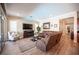 Cozy living room with comfortable seating, large windows, and an open floor plan to the rest of the home at 3468 Isle Dr, Las Vegas, NV 89141
