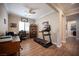 Spacious home office featuring crown molding, natural light, and a dedicated workout area at 3468 Isle Dr, Las Vegas, NV 89141