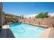 Beautiful backyard pool with a water feature and a covered patio perfect for outdoor relaxation and entertaining at 3468 Isle Dr, Las Vegas, NV 89141