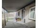 Covered back porch with metal supports, an exterior entrance, and an enclosed fence at 4184 Lady Lucille Ct, Las Vegas, NV 89115