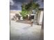 Enclosed backyard featuring white gravel, storage sheds, and a covered wall at 4184 Lady Lucille Ct, Las Vegas, NV 89115