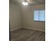 Cozy bedroom with neutral walls, wood floors, and natural light, perfect for relaxation at 4184 Lady Lucille Ct, Las Vegas, NV 89115