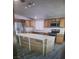 Bright kitchen featuring wood cabinets, granite countertops, and stainless steel appliances at 4184 Lady Lucille Ct, Las Vegas, NV 89115