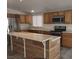 Bright kitchen boasting stainless steel appliances, a functional island, and stylish flooring at 4184 Lady Lucille Ct, Las Vegas, NV 89115