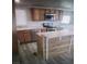 Spacious kitchen with wood cabinets, granite countertops, and modern stainless steel appliances at 4184 Lady Lucille Ct, Las Vegas, NV 89115