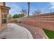 Private backyard with a fountain, brick wall, and manicured landscaping; perfect for outdoor entertaining at 4204 Sprints Race Ave, North Las Vegas, NV 89084