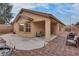 Outdoor patio with seating and backyard views, ideal for relaxing or entertaining guests at 4204 Sprints Race Ave, North Las Vegas, NV 89084