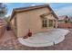 A rear view of a home highlighting its backyard with a paver patio for outdoor enjoyment at 4204 Sprints Race Ave, North Las Vegas, NV 89084