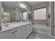 Bright bathroom with double sink vanity, soaking tub, and neutral color palette at 4204 Sprints Race Ave, North Las Vegas, NV 89084