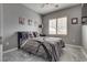Inviting bedroom with shutters, gray walls, and durable easy to clean flooring at 4204 Sprints Race Ave, North Las Vegas, NV 89084